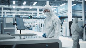 Printed Circuit Board Production At Electronics Factory: Scientist In Sterile Suit Using Soldering Jet Printer To Make Modern Motherboards For Powerful CPUs. Computer Hardware Manufacturing Facility. - Powered by Shutterstock - Get 15% off with code: PIKWIZARD15