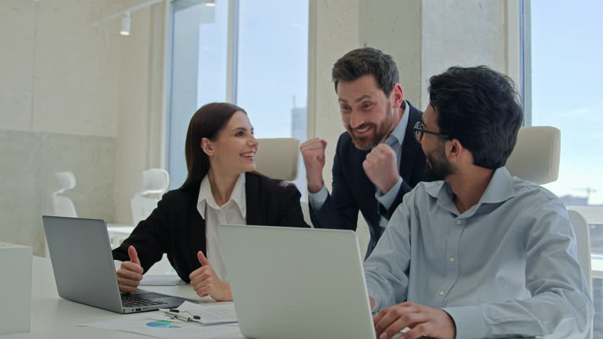 Business team creative diverse coworkers celebrate victory in office happy multiracial colleagues employees brainstorm corporate teamwork male boss businessman rejoice good news win deal success sales Royalty-Free Stock Footage #3392667285
