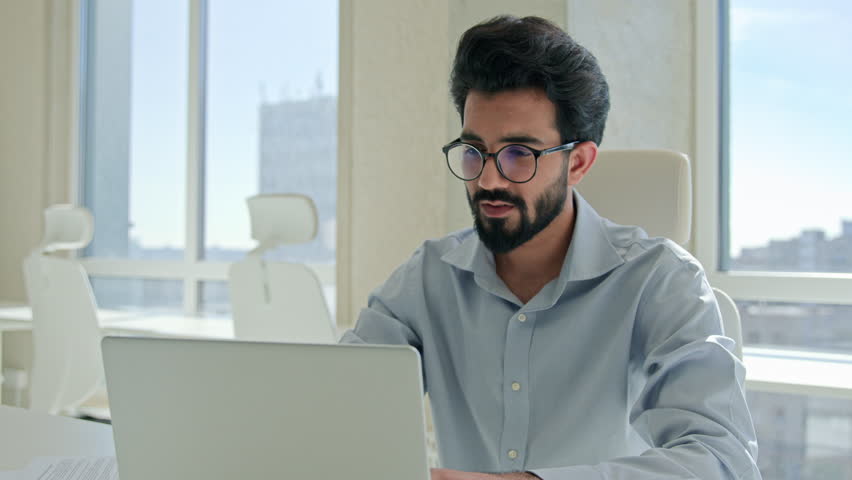 Arabian Indian man tired exhausted worker manager working laptop computer sick businessman rubbing dry itchy eyes male business employer overwork in office take off glasses feel headache bad vision Royalty-Free Stock Footage #3392678551
