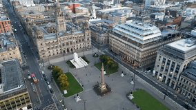 Flight over George Square in Glasgow City Center. Aerial - Glasgow City from above. Cinematic drone footage. 