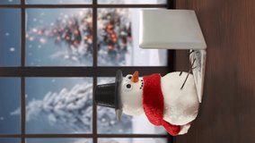 Snowman looking for Christmas gifts, browsing Christmas shopping online using laptop. Home. Winter Christmas tree background outside the window. Snowman ordering present for Christmas. Vertical video - Powered by Shutterstock - Get 15% off with code: PIKWIZARD15