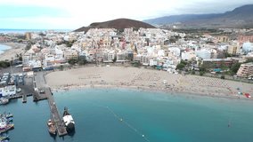 Aerial footage of a beach in Los Cristianos, Tenerife, Spain