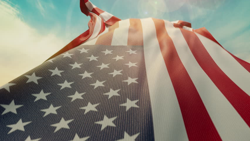 Wavy flag of United States of America blowing in the wind in slow motion. Waving official USA flag team symbol abstract vertical background. Blue sky with clouds. World countries flying flags concept Royalty-Free Stock Footage #3392910557