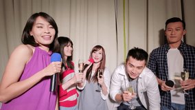 young people take champagne and singing happily with party