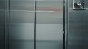 Doctor moves elderly woman in transport wheelchair from elevator. Medic takes patient on procedures or to operating room walking along the clinic corridor. Medical staff, patients in hospital hallway. - Powered by Shutterstock - Get 15% off with code: PIKWIZARD15