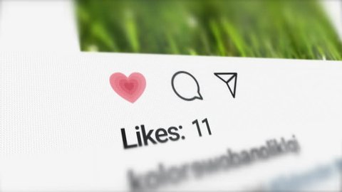 London / UK - Dec 14 2018: Editorial Animation of the New Post on Social Media and Increasing Likes Counter on the LCD screen. Close up to Like, Comment and Send Icons. Successful Instagram Post. 