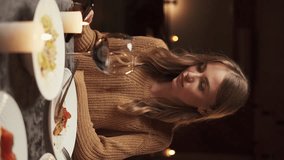 Valentine's Day celebration concept. Couple in love having dinner at home, man giving surprise to girlfriend while sitting at table in kitchen - Powered by Shutterstock - Get 15% off with code: PIKWIZARD15