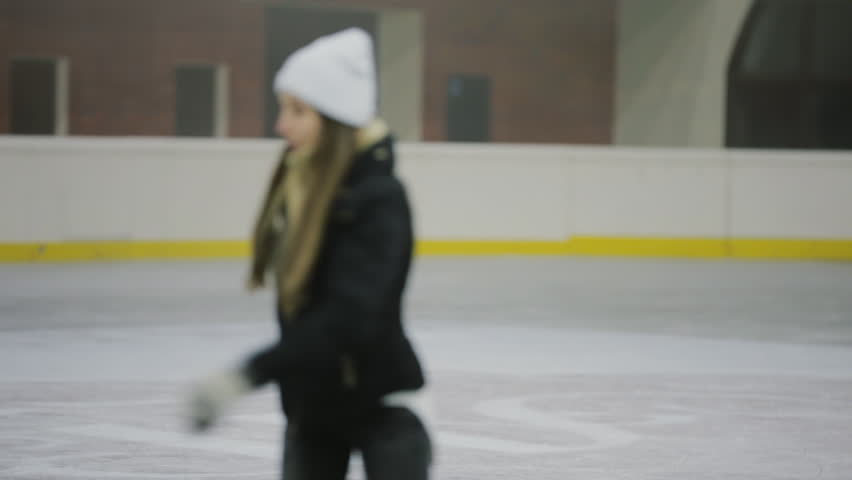 Woman skating on an ice rink
