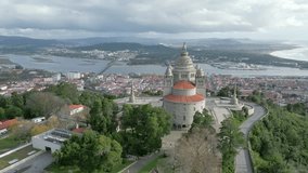 Elevated view of Santa Luzia sanctuary, Viana do Castelo's icon, Portugal, overlooking sea and city - Aerial footage