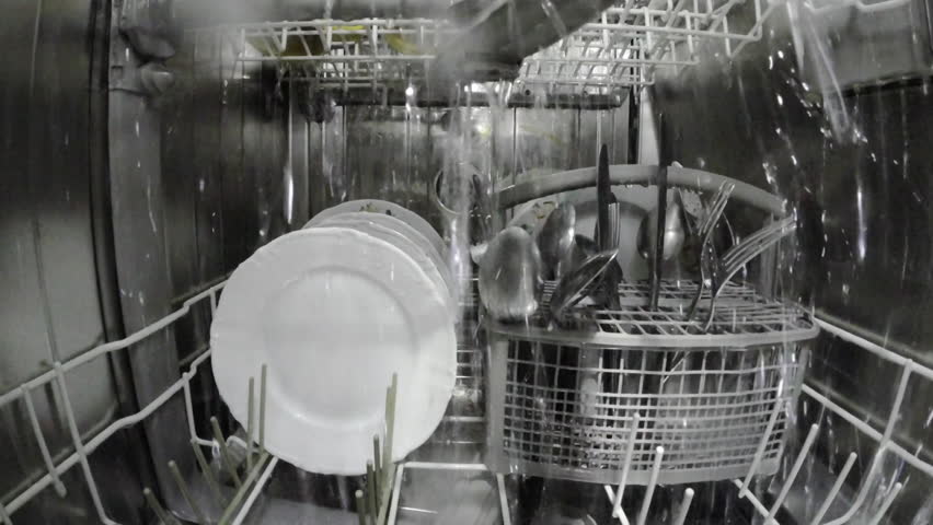 The dishwasher washes the dishes. View from inside  Royalty-Free Stock Footage #3393407123