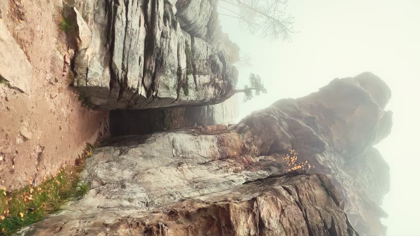 Stone City in autumn. Bright foliage and autumn landscape. The natural landscape is a rock formation in Central Russia, the Urals. A natural monument. Ancient rocky folding in the Ural Mountains. 4K