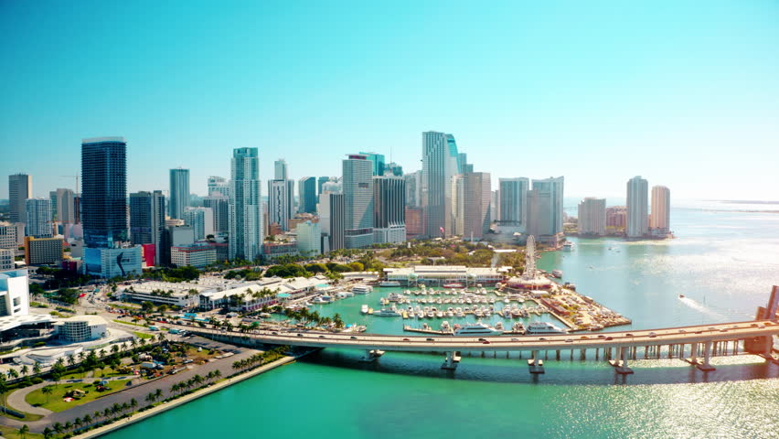 Modern downtown skyscrapers along Miami river. Aerial video of yachts at a miami florida marina.  Royalty-Free Stock Footage #3393509299