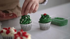 woman prepares cake and pastries. decorate the muffin.decorate the muffin. slow motion video. High-quality shooting in 4K format.
