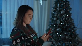 Festive Video Calls: Woman Connecting with Family, Celebrating Christmas and New Year Virtually, Spreading Holiday Cheer. High quality 4k footage