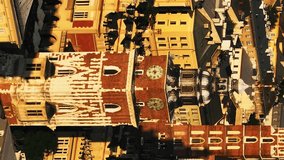 Cinematic Aerial Shot of Old Town Square in Krakow, Poland. Main Market square or Rynek Glowny with a Town Hall, Sukiennice and St. Mary's Basilica church. Aerial vertical, vertical video background.