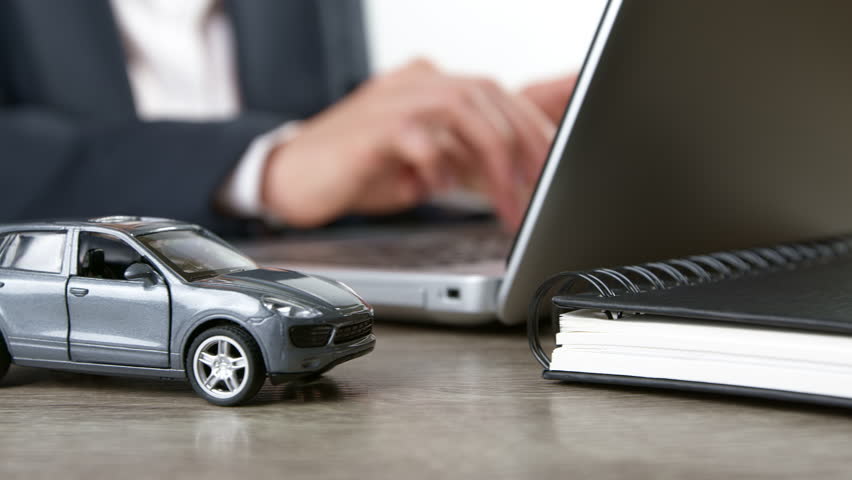Online car insurance concept using laptop. Renting or buying a car. Royalty-Free Stock Footage #3393833257
