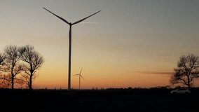 wind power plants at sunset footage videos.