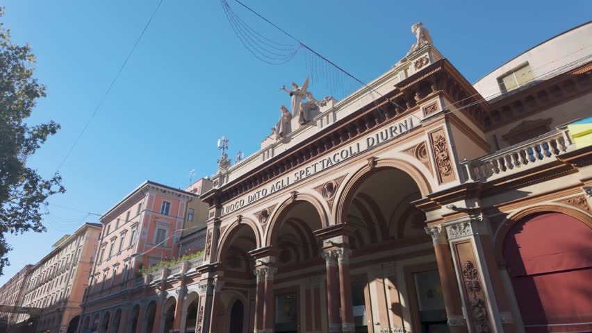 Slow pan shot up of Teatro Arena del Sole facade entrance in Bologna on a bright sunny day in 4K.  Royalty-Free Stock Footage #3394024505