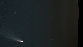 Time lapse of comet NEOWISE moves across the night sky among the stars. Vertical video - Powered by Shutterstock - Get 15% off with code: PIKWIZARD15