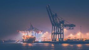 Gantry cranes overloading the containers at night, time lapse - Powered by Shutterstock - Get 15% off with code: PIKWIZARD15