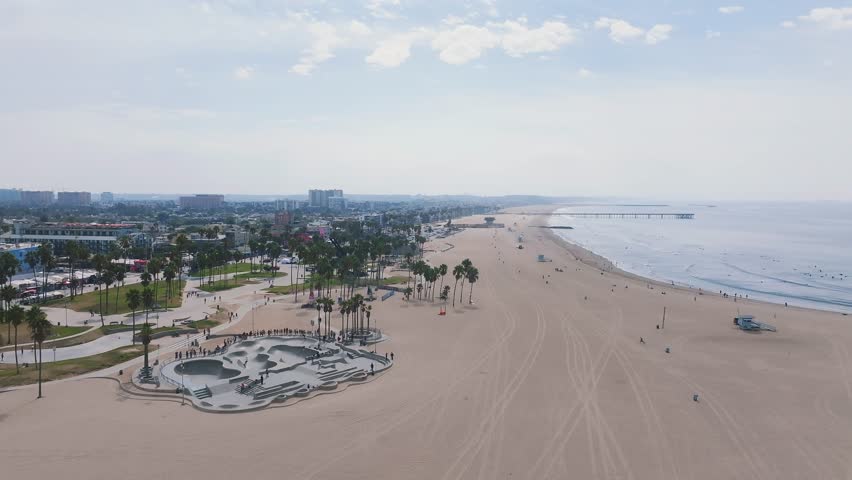 Aerial view of the skate board park in Venice beach at sunset, California, USA. Beautiful Venice beach vibe. People skating in Los Angeles.