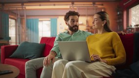 Portrait of Young Couple Using a Laptop Computer While Sitting On a Couch. Newly Wed Husband and Wife Checking Real Estate Market to Find Their Future Home, Discussing Possibilities. Slow Motion - Powered by Shutterstock - Get 15% off with code: PIKWIZARD15