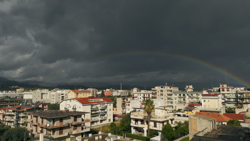 Rainbow shining on an urban view 