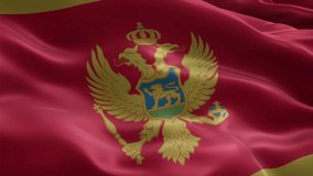 Montenegro flag video waving in wind. Realistic flag background. Close up view, perfect loop, 4K footage