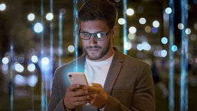 Handsome Caucasian Breaded Business Man in Glasses using Smart Phone in Modern City. Beams of Light Big Data Information going up. Internet of Things, Virtual Augmented Reality,  Metaverse. - Powered by Shutterstock - Get 15% off with code: PIKWIZARD15