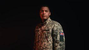Portrait of professional soldier in army uniform with United Kingdom flag patch - Powered by Shutterstock - Get 15% off with code: PIKWIZARD15