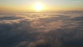 Aerial shot of the sunrise above a layer of clouds - Powered by Shutterstock - Get 15% off with code: PIKWIZARD15