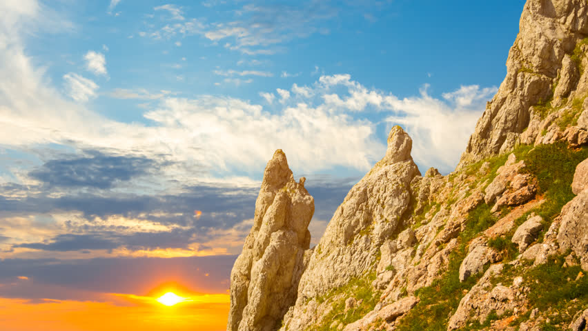 rocky mount slope at the dramatic sunset, natural mountinering time lapse scene