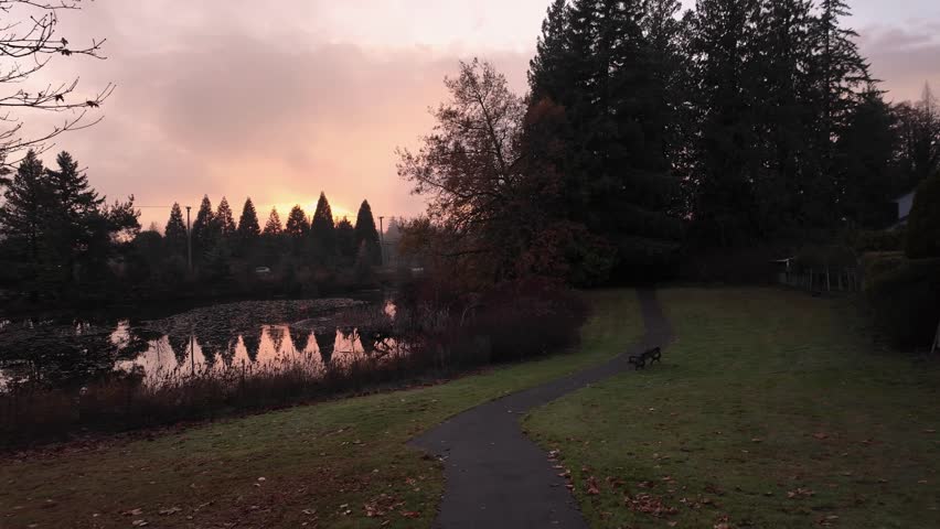 Path by a Lake in Suburban Neighborhood in Surrey. Fall Season, Sunset. Surrey, Vancouver, British Columbia, Canada