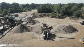 Aerial drone video of Gravel separator machine separates stone material into various fractions.