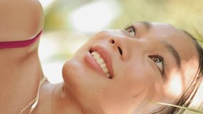 Vertical Video. Charming Young Asian Fashion Model Posing Outside, Wearing Jewelry. Cute Smiling Chinese Lady Outdoors. Jewelry Advertising. People and Advertising Concept - Powered by Shutterstock - Get 15% off with code: PIKWIZARD15