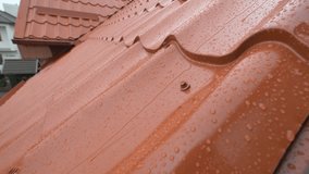 Rain Hitting Modern House Roof Tiles during Thunderstorm Water Drops Close Up - Powered by Shutterstock - Get 15% off with code: PIKWIZARD15