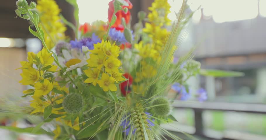 Bouquet of flowers on the festive table. Beautiful flowers on the table. Bouquet of flowers on the table Royalty-Free Stock Footage #3395149405