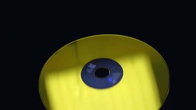 Golden laser disc sparkles, flies and rotates on a black background. Close Up. Slow mo, slo mo, slow motion, high speed camera, 240 fps, 250 fps - Powered by Shutterstock - Get 15% off with code: PIKWIZARD15