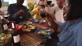 selfie of group of friends toasting with wine glasses on the table while having dinner and celebrating a party - Powered by Shutterstock - Get 15% off with code: PIKWIZARD15