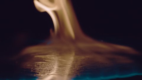 Ignition of gasoline with an electric lighter. The blue wave of fire moves to the camera. Macro. Closeup. S-log - High Dynamic Range. Slow mo, slo mo, slow motion, high speed camera, 240fps, 250fps