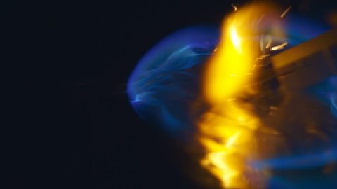Burning gasoline, a blue wave of fire with sparks runs forward, and behind it is an orange fire. S-log - High Dynamic Range. Closeup. Slow mo, slo mo, slow motion, high speed camera, 240fps, 250fps
