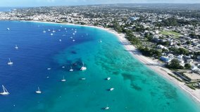 Aerial landscape video view of shoreline and bay area along Carlisle Bay (with turquoise water)  at Bridgetown,  overflying Pebbles Beach, Brownes Beach and Bayshore Beach at Barbados,  video footage 