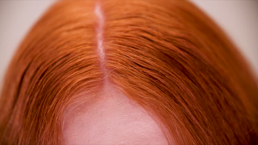 Close-up of red hair. A girl with red hair, close-up of the girl's head. Royalty-Free Stock Footage #3395220183