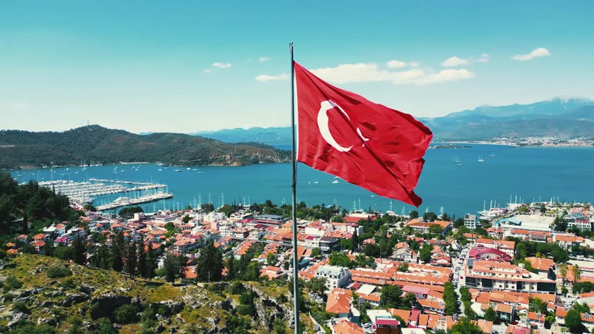 The Turkish flag flutters against the backdrop of a stunning landscape. Turkey, Istanbul. Royalty-Free Stock Footage #3395242463