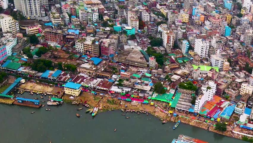 Dhaka city slums running along the Buriganga river, Bangladesh. Aerial