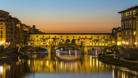 Ponte Vecchio Florence zoom Timelapse at night and Arno river in Florence Italy City. Reflection on water. Footage in 4K.