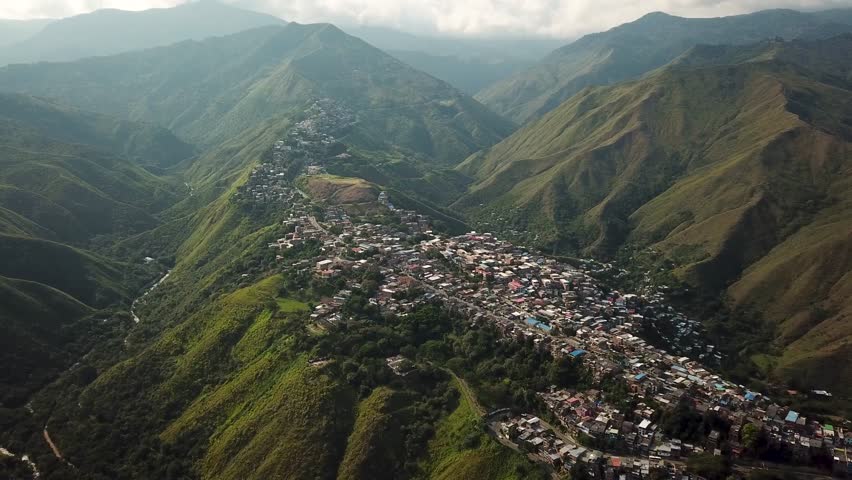 Aerial drone footage of Cali, Colombia, South America. Drone shot of favela in the hills near Cali, Latin America. High quality 4k footage.