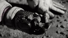 Close up of Astronaut holding Regolith on the Moon - Powered by Shutterstock - Get 15% off with code: PIKWIZARD15