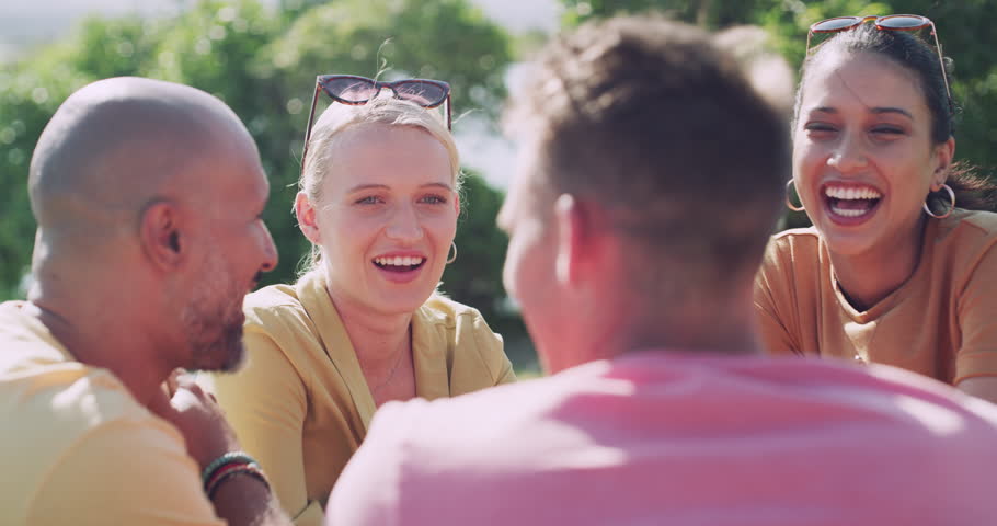 Friends, people and laughing outdoor by river for conversation, communication and talking with wind. Man, women and discussion for bonding, connection and relax on weekend or group by lake in summer