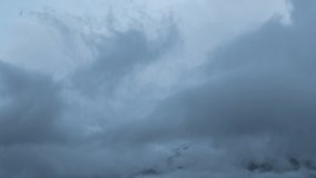 4k zoom in timelapse of storm clouds moving over snowy mountains in Keylong, India. Bad weather in winter. Winter mountains landscape. Snow storm on snowy peaks of Himalayas. Ken burn timelapse.  - Powered by Shutterstock - Get 15% off with code: PIKWIZARD15